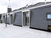 Terrasse avec façade en ardoise