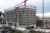 Apartment house with construction site scaffolding